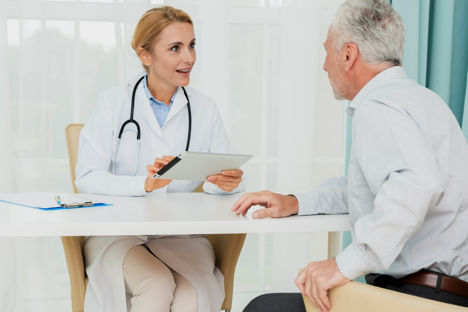 A doctor consulting with a patient in a healthcare setting.